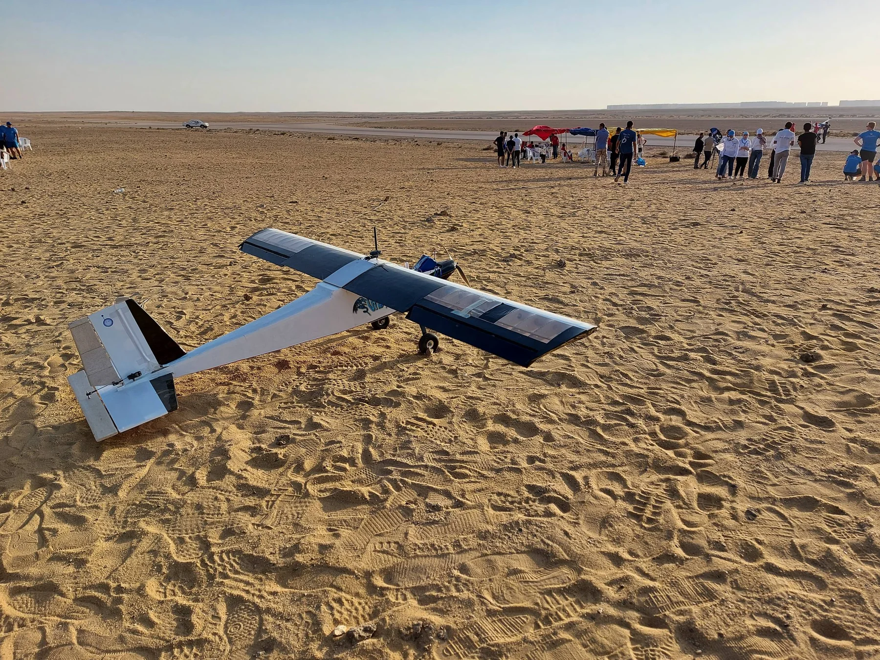 RobEn's fixed-wing UAV in the desert during a field competition